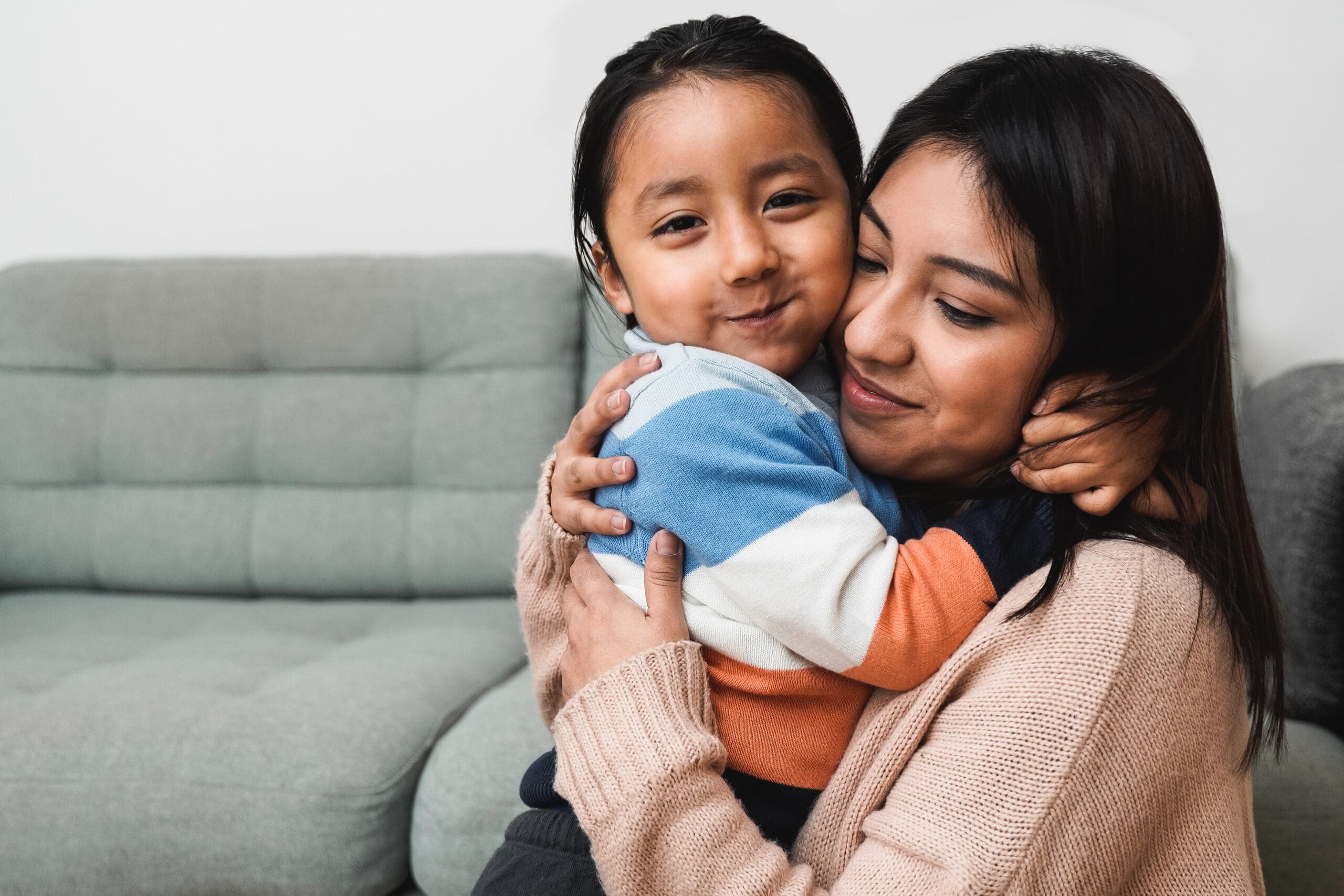 Parent and child sharing a supportive moment that reflects family counseling and children's behavioral health services.